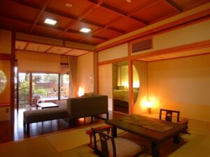 Tatami room with low table, chairs, and sofa