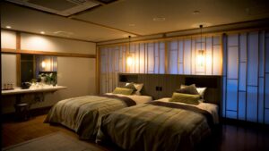 Twin beds in a softly lit guest room