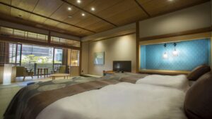 Twin beds in a tatami-style ryokan guest room
