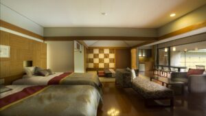 Two beds in a spacious ryokan guest room