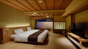 畳風の客室のツインベッド