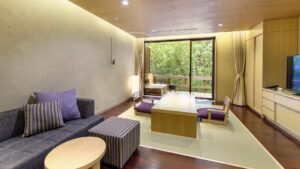In-room seating area with sofa, chairs, and table