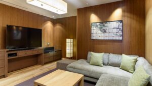 Living area with sofa, table, and television