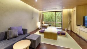 Tatami seating area with sofa and chairs by window