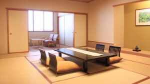 Habitación de tatami con mesa baja y sillas de suelo