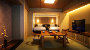 Tatami-Zimmer mit niedrigem Tisch und dahinter stehenden Betten