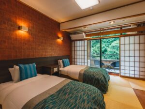 Twin beds in a tatami room with balcony