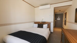 Single bed in a compact guest room