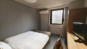 Single bed in a compact guest room