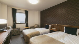 Twin beds in a guest room with window seating