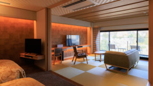 Tatami guest room with sofa, desk, and window seating