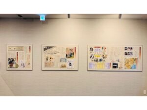 Framed posters displayed on a hallway wall