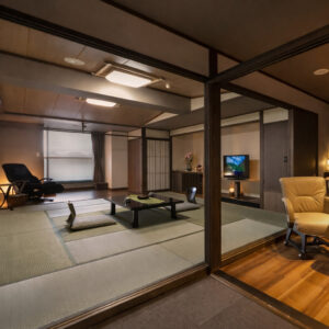 Spacious tatami room with low table and chair