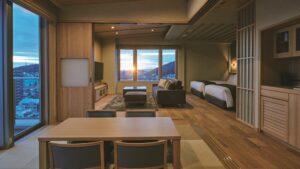 Guest room with sofa seating area and bed