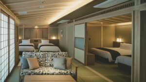 Japanese-style room with beds and sofa seating