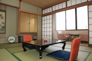 Tatami room with low table and floor chairs