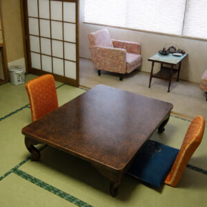 Tatami seating area with low table and chairs