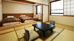 畳敷きの客室のツインベッド