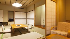 Camera in tatami con tavolo basso, sedie da pavimento e poltrona