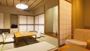 Camera con tatami, tavolo basso, sedie da pavimento e poltrona