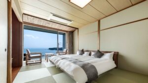 Beds in tatami room facing ocean balcony