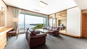 Guest room with sofas, tatami area, and ocean view