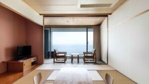 Tatami room with table, chairs, and ocean view