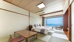 Tatami room with twin beds and ocean-facing sitting area