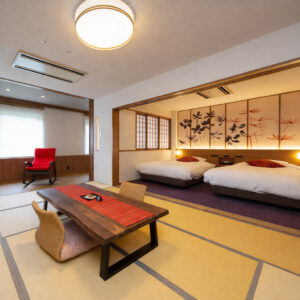 Chambre en tatami avec deux lits et table basse