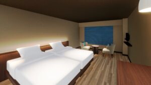 Lits jumeaux et coin salon dans la chambre