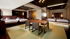 Modern Japanese-style room with four beds and tatami table