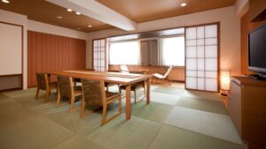 Tatami room with dining table, chairs, and lounge chairs