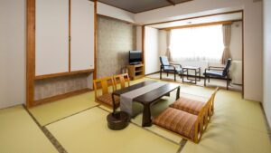 Tatami room with low table and chairs by window