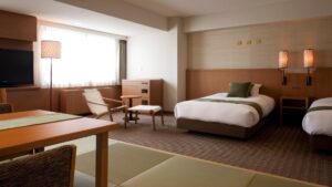 Twin beds and seating area in guest room