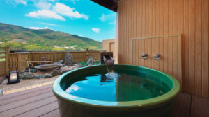 Private open-air bath on a terrace with mountain view