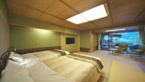 Twin beds in a tatami guest room