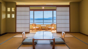 Tatami room with low table and chairs by window