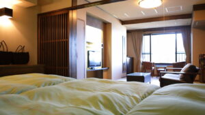 Beds in a guest room with seating area