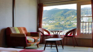 Chairs and table by a large window in the room