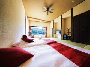 Guest room with two beds and tatami seating area