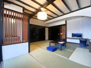 Tatami guest room with low table and floor cushions