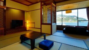 Tatami room with low table and window by the sea