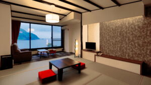 Tatami room with low table, chairs, and ocean window