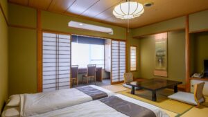 Tatami guest room with low table and twin beds