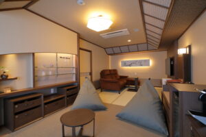 Tatami seating area with beanbags and armchairs