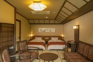 Twin beds in a tatami-style ryokan room