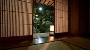 Garden view through open shoji doors from tatami room