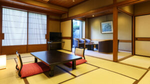 Tatami room with low table and chairs by window