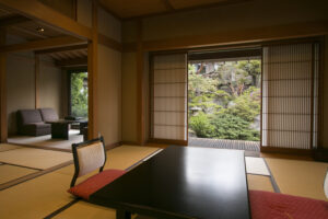 Tatami room with low table and garden-facing open doors