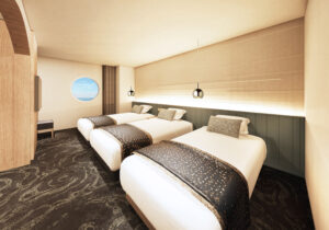 Trois lits dans une chambre moderne